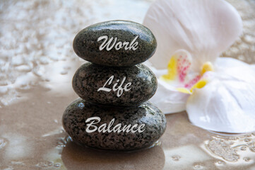 Work life balance text engraved on stones. New ways of working culture. Conceptual.