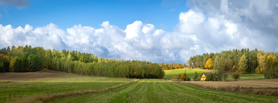 panorama october landscape - autumn sunny day, beautiful trees with colorful leaves, Poland, Europe, Podlasie, a village near the forest