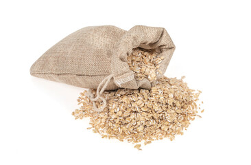Oat flakes in jute burlap bag isolated on white background, close up. oatmeal. barley flakes. rolled oat