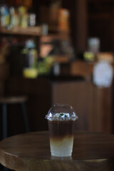 A cup of ice amaricano on the table