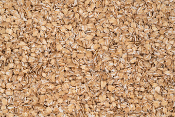 Oat flakes texture background, close up. oatmeal. barley flakes. rolled oat