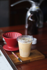 Closeup of Iced Caramel Macchiato at the coffee shop, Caramel Macchiato is a classic macchiato beverage. It consists of vanilla syrup, espresso, steamed milk, foam, and caramel drizzle
