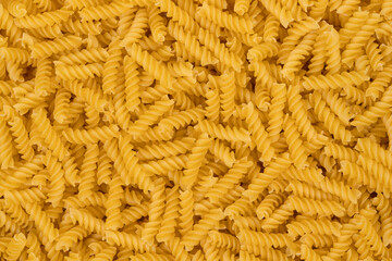 Spiral pasta background texture closeup