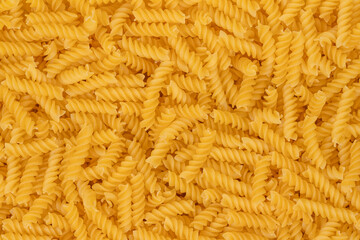 Spiral pasta background texture closeup