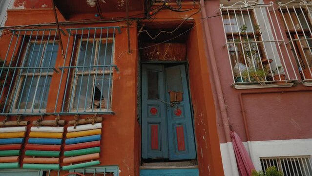 Facade of colored house in Jewish quarter of Istanbul, Turkey. Balat district, Kiremit Street, historical and touristic area with old buildings, Travel, tourism concept