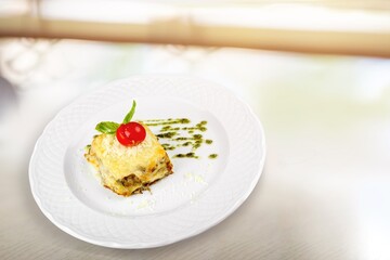 Tasty fresh lasagna dish on white plate