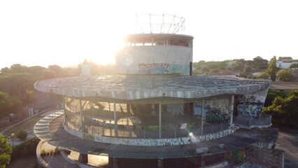 Aerial drone view of abandoned restaurant and viewpoint panoramic building in European art deco style the middle of Monsanto forest in Lisbon Portugal.