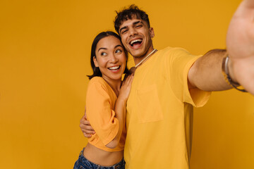 Selfie of young beautiful stylish smiling happy couple