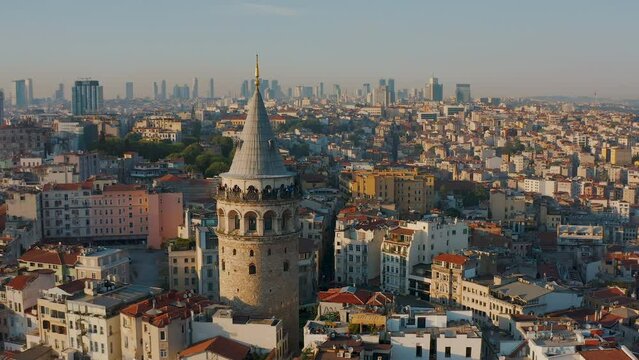 Galata tower in Istanbul, Turkey at sunset, sunny day, golden hour. Aerial drone shot from above, European part of city, downtown, most popular landmark, beautiful landscape, tourism
