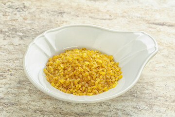 Raw bulgur in the bowl