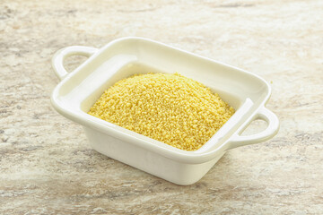 Raw couscous in the bowl