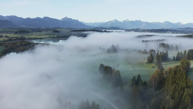 Aerial view of the river Lech with fog in autumn near Steingaden