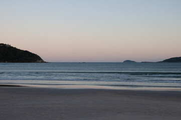 View of Praia do Sonho with mountains in the background