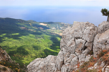 Fototapeta na wymiar Picturesque view of the city of Yalta and the Black Sea from Ai Petri mountain in the Crimea.