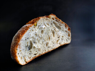 Close up Side view inside of baked brown sourdough, natural yeast, artisan, with dark background