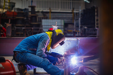 Welding male worker metal steel is part of beam structure