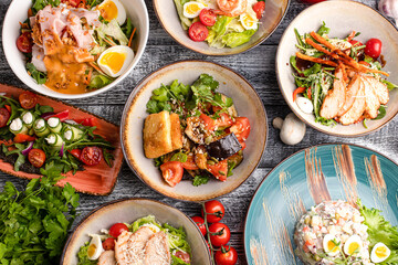 Several types of salads, many salads on a white background, side view