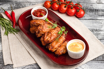 Chicken wings, chicken wings appetizer on a wooden white background
