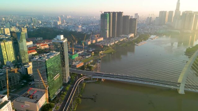 Aerial view of Ho Chi Minh City skyline and skyscrapers on Saigon river, center of heart business at downtown. Morning view. Far away is Landmark 81 skyscraper