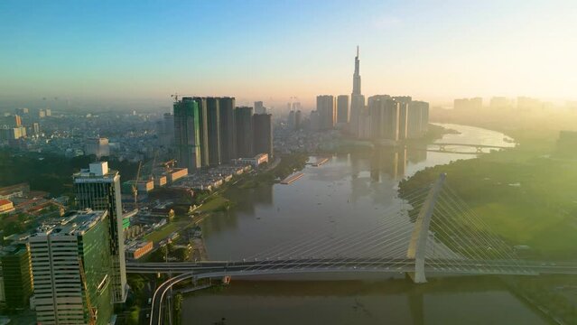 Aerial view of Ho Chi Minh City skyline and skyscrapers on Saigon river, center of heart business at downtown. Morning view. Far away is Landmark 81 skyscraper