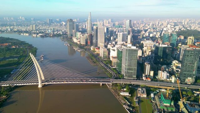 Aerial view of Ho Chi Minh City skyline and skyscrapers on Saigon river, center of heart business at downtown. Morning view. Far away is Landmark 81 skyscraper