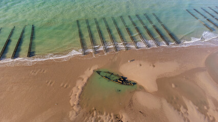 shipwreck on the beach in the water