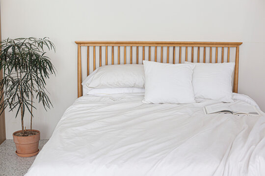 bedroom interior with white sheet bed