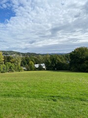 landscape of meadows with clouds and blue sky, Germany