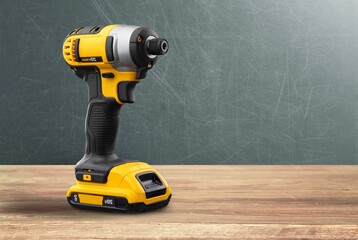 Classic construction drill on the desk. Work tools