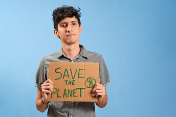 Serious young man with save the planet sign, isolated. Concept climate change