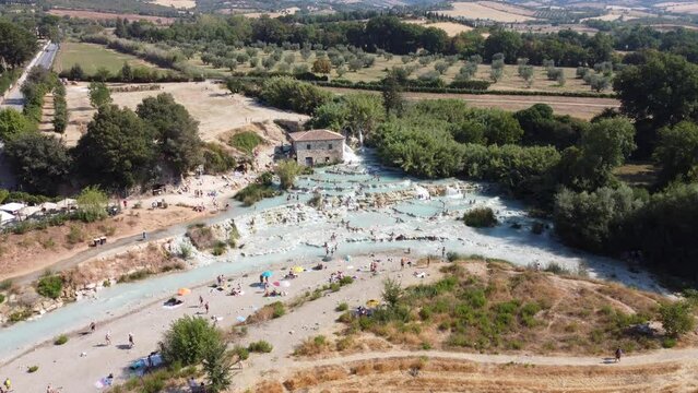 Aerial view of waterfalls and hot springs at Saturnia thermal baths in Tuscany, Italy