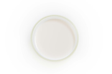 Milk in a glass isolated on white background, top view.