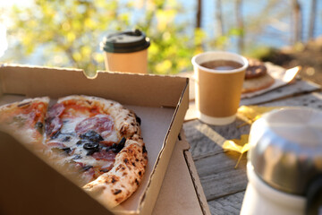 Picnic in autumn with tea and pizza