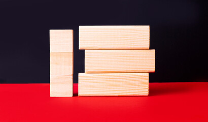 On a black and red background, wooden cubes and blocks with a place to insert text