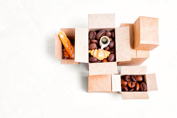 Miniature boxes with coffee and bakery products