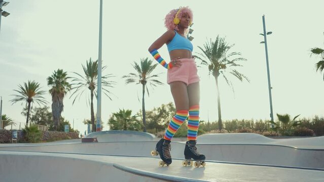 Beautiful woman skating with roller skates and having fun. Professional skater and dancer training in the morning