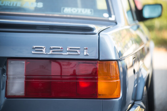 Mulhouse - France - 9 October 2022 -  Rear view of blue eighties BMW 325I parked in the street