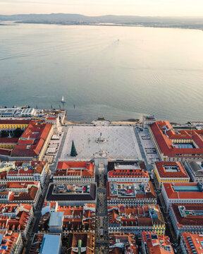 Aerial view of Lisbon main square (Praca do Comercio) along the Tagus river at sunset, Lisbon, Portugal.