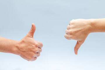 Two hands gesturing on a blue background