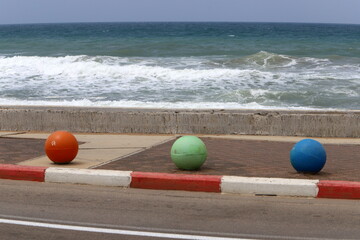 Road barriers along the sidewalk for the safe passage of pedestrians.