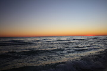 Fototapeta na wymiar Sunsets and Silhouettes Florida Coastline Inlet Beach 