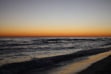 Fototapeta na wymiar Sunsets and Silhouettes Florida Coastline Inlet Beach 