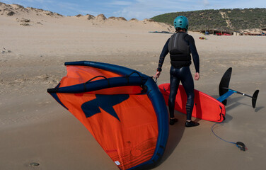 person wind foiling in tarifa