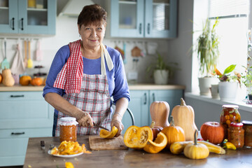 elderly woman cooking pumpkin