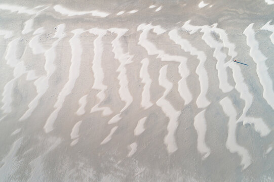 Abstract aerial top view of amazing sand lines created by the wind at the North Sea beach near Slufter valley, Texel, Noord-Holland, Netherlands.