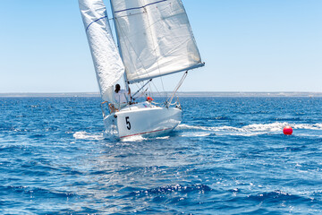 White small yacht during sailing regatta