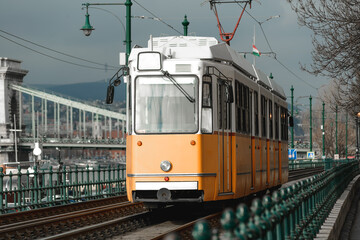 Fototapeta na wymiar Vintage orange tram somewhere in Budapest, Hungary