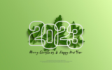 Happy New Year 2023 and merry christmas day. Design number outline on group of green leaves on green gradient background.