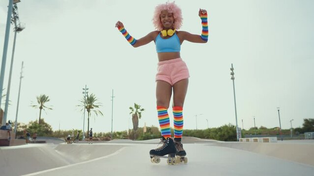 Beautiful woman skating with roller skates and having fun. Professional skater and dancer training in the morning