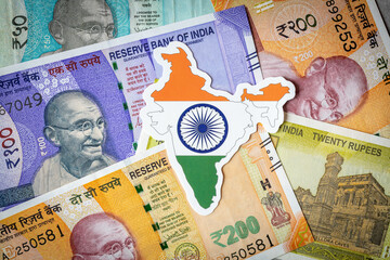 Indian money, various banknotes of the new series, Indian flag with country shape, Economic...